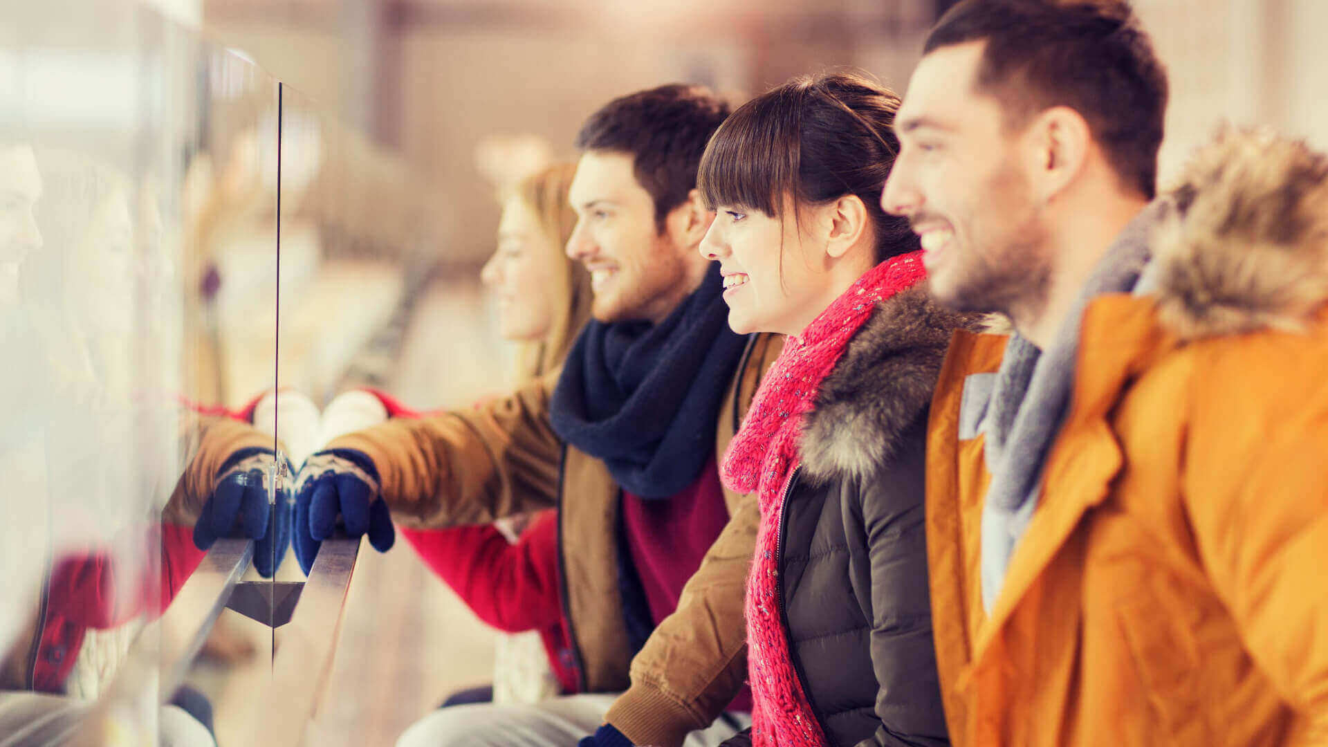 people wearing coats at a hockey game